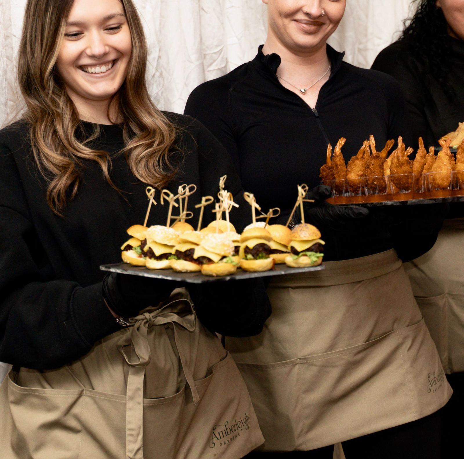 Catering team serving guests at an Amberleigh Gardens wedding